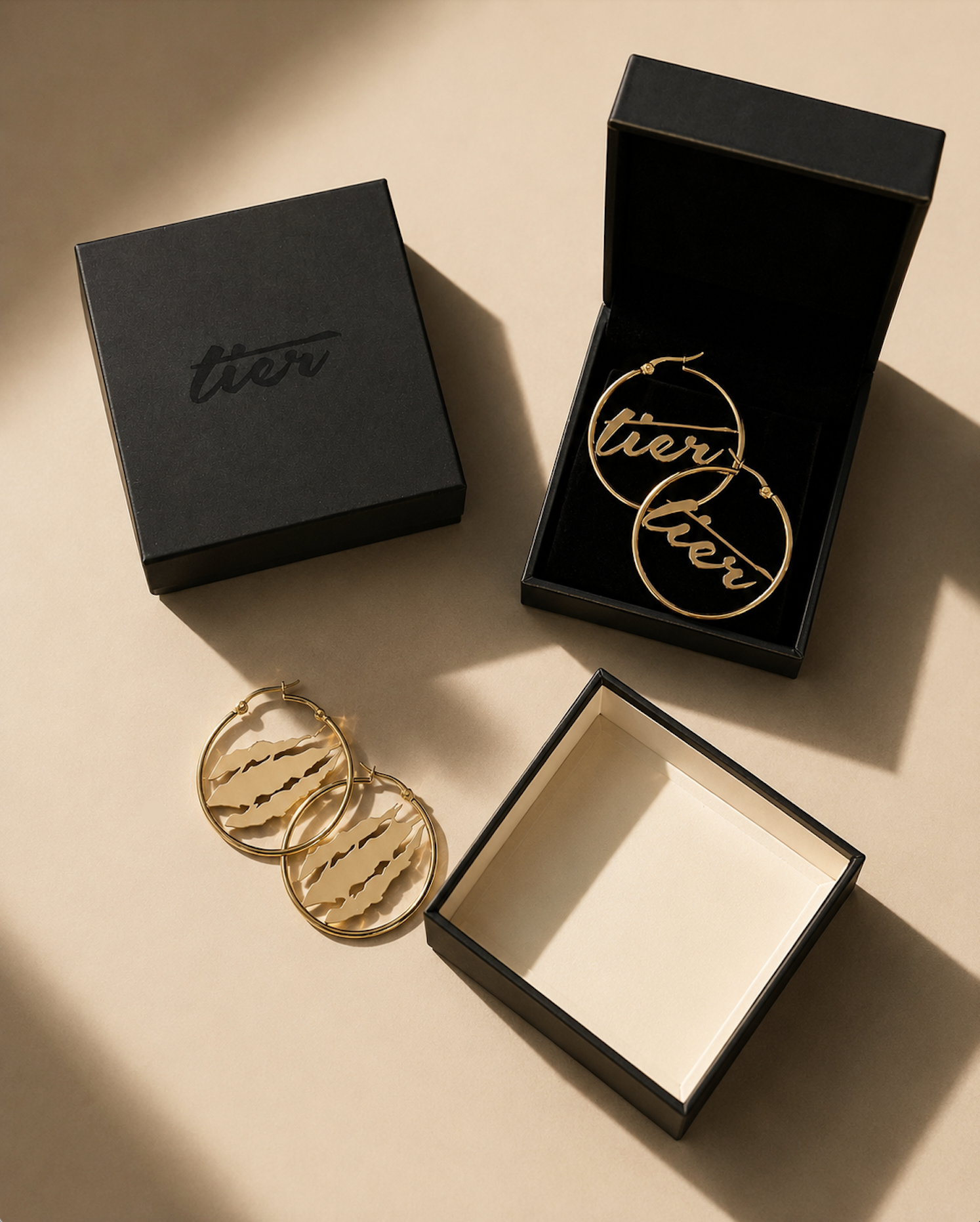 TIER Rip logo earrings